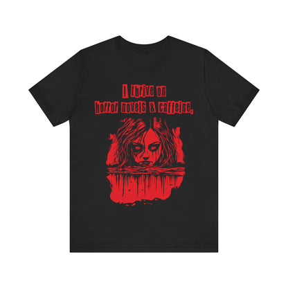 I thrive on horror novels and caffeine Unisex Jersey Short Sleeve Tee