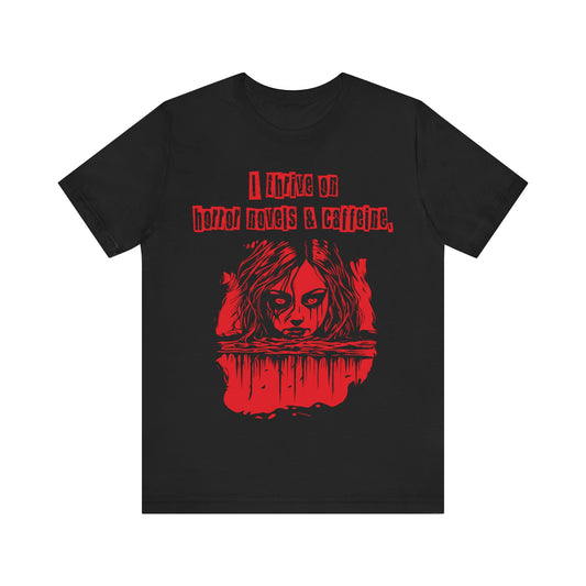 I thrive on horror novels and caffeine Unisex Jersey Short Sleeve Tee