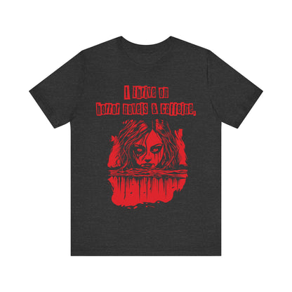 I thrive on horror novels and caffeine Unisex Jersey Short Sleeve Tee